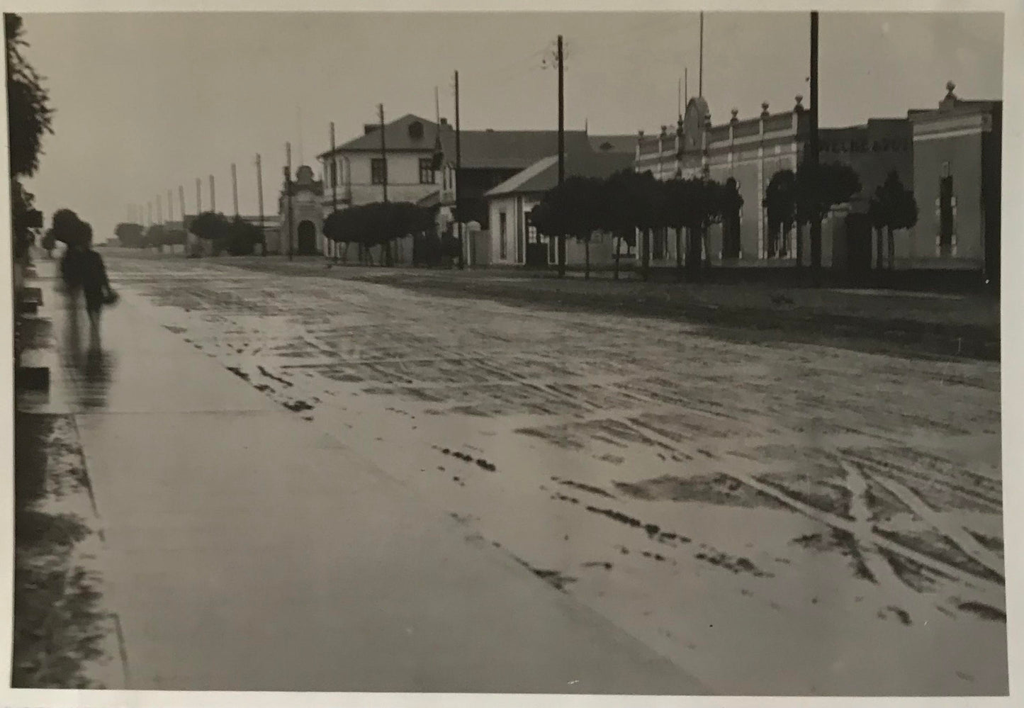 PC SWK 12.6. SWA Postkarte - Kaiserstrasse nach dem Regen, Swakopmund, 1934 / SWA Postcard - Kaiserstrasse after the rain, Swakopmund, 1934, Wecke & Voigts