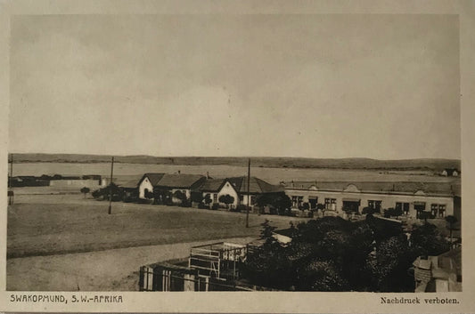PC SWK 9.2. DSWA Postkarte - Häuser von Swakopmund mit Dünenblick / DGSWA Postcard - Houses of Swakopmund with dune view